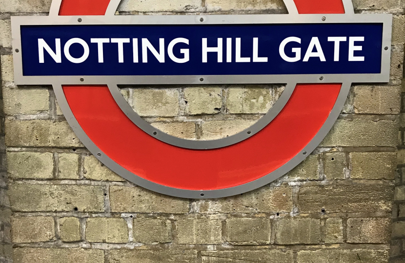 Notting Hill Gate London Underground station sign and logo on wall