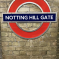 Notting Hill Gate London Underground station sign and logo on wall